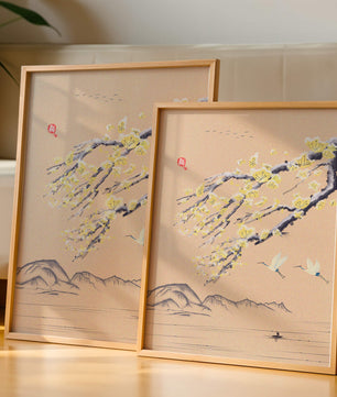 Tranquil landscape with blooming branches and flying cranes