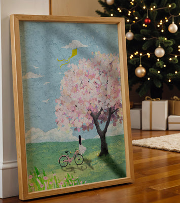 Springtime scene with cherry blossom and girl with bicycle