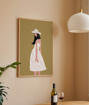 Woman in a white dress and hat on a gold background