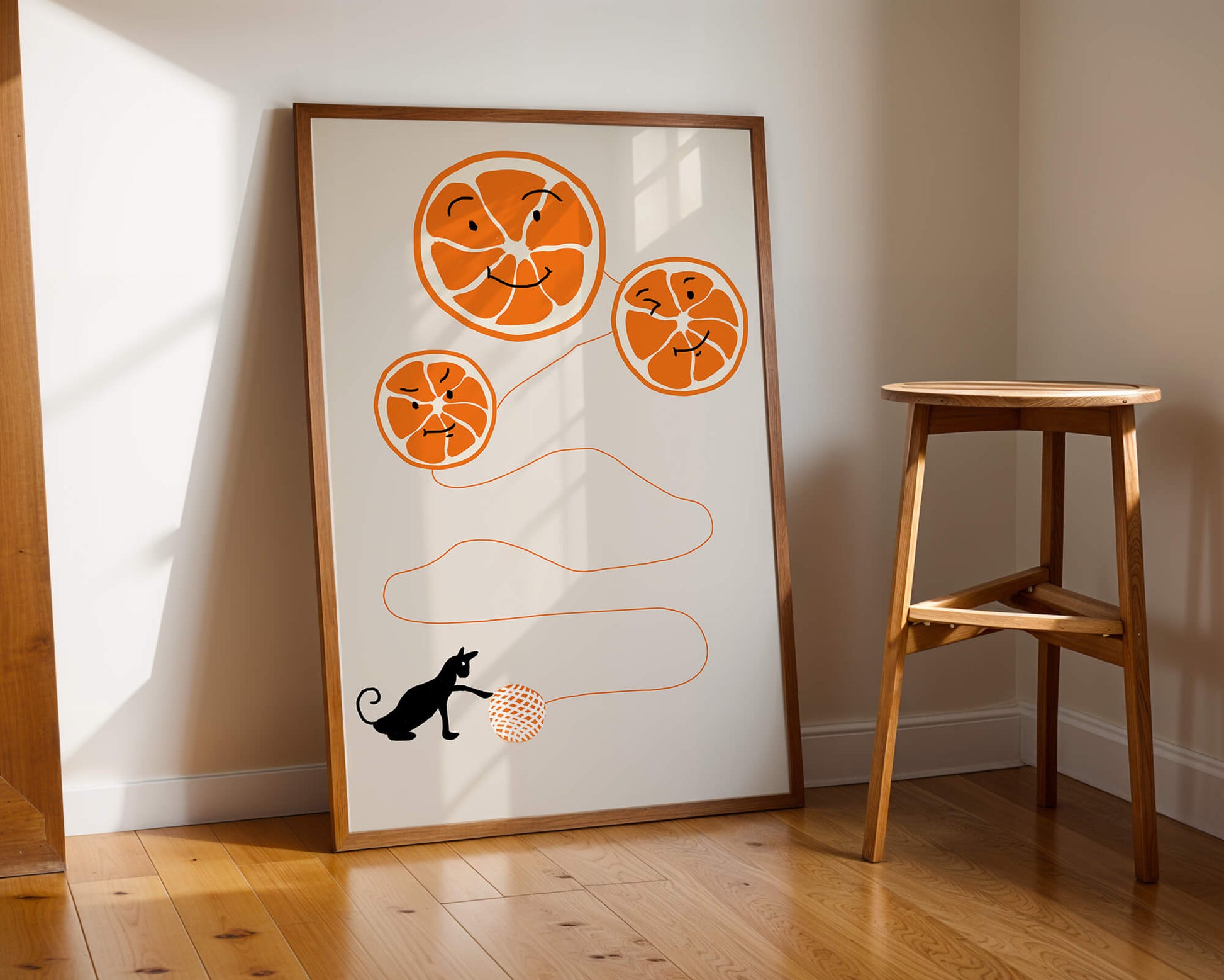 Playful illustration of oranges with cat and yarn