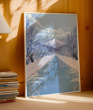 Serene winter landscape with mountain and snowy trees reflecting in water