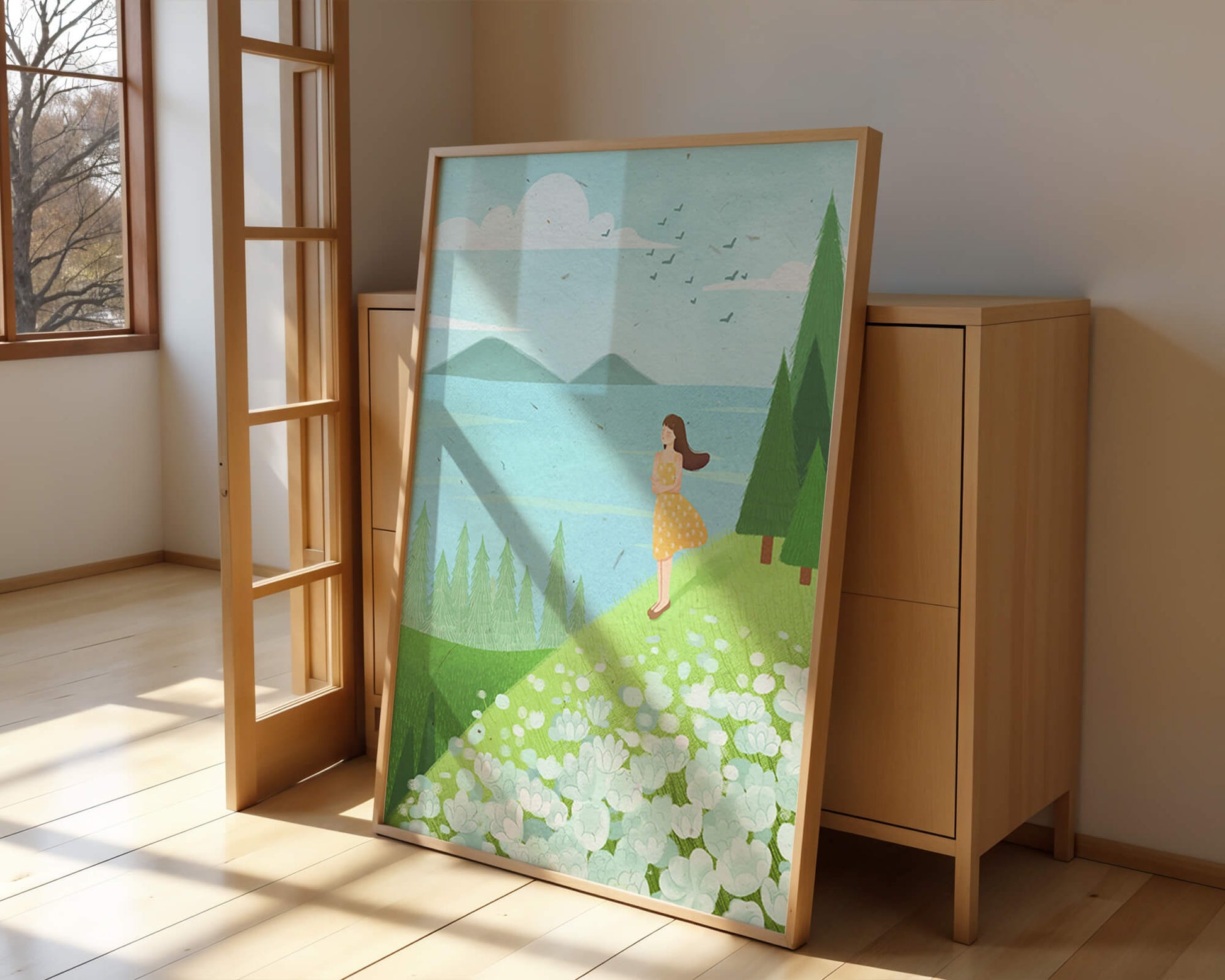 Mujer en vestido amarillo en la ladera con flores y árboles