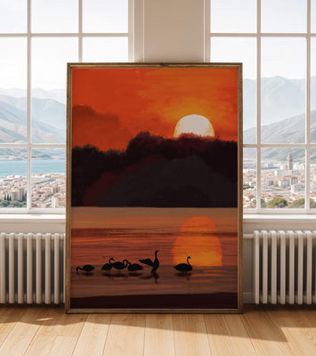 Serene sunset over a lake with silhouetted swans