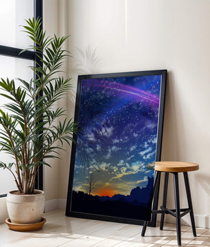 Starlit night sky with colorful sunset and silhouetted landscape