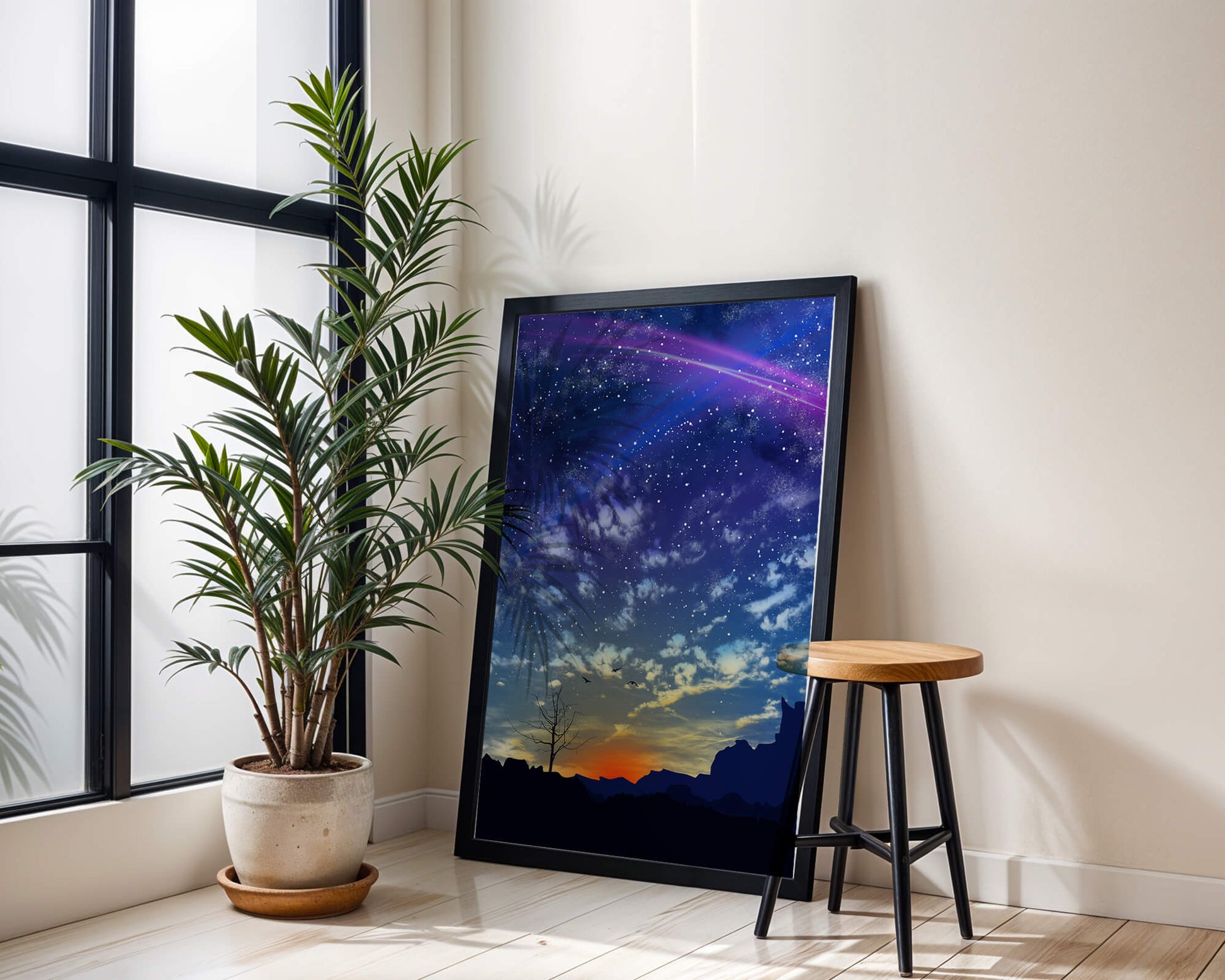 Starlit night sky with colorful sunset and silhouetted landscape