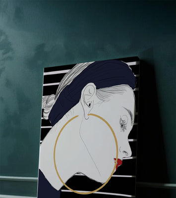 Profile of woman with hoop earrings and striped headscarf