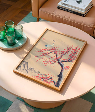 Elegant crane on cherry blossom tree with mountainous background