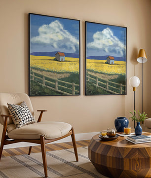 Idyllic rural scene with house and yellow field under blue sky