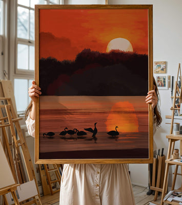 Serene sunset over a lake with silhouetted swans