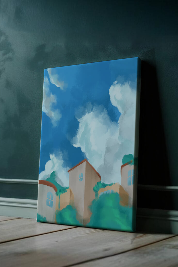 Serene landscape with houses and fluffy clouds against a blue sky