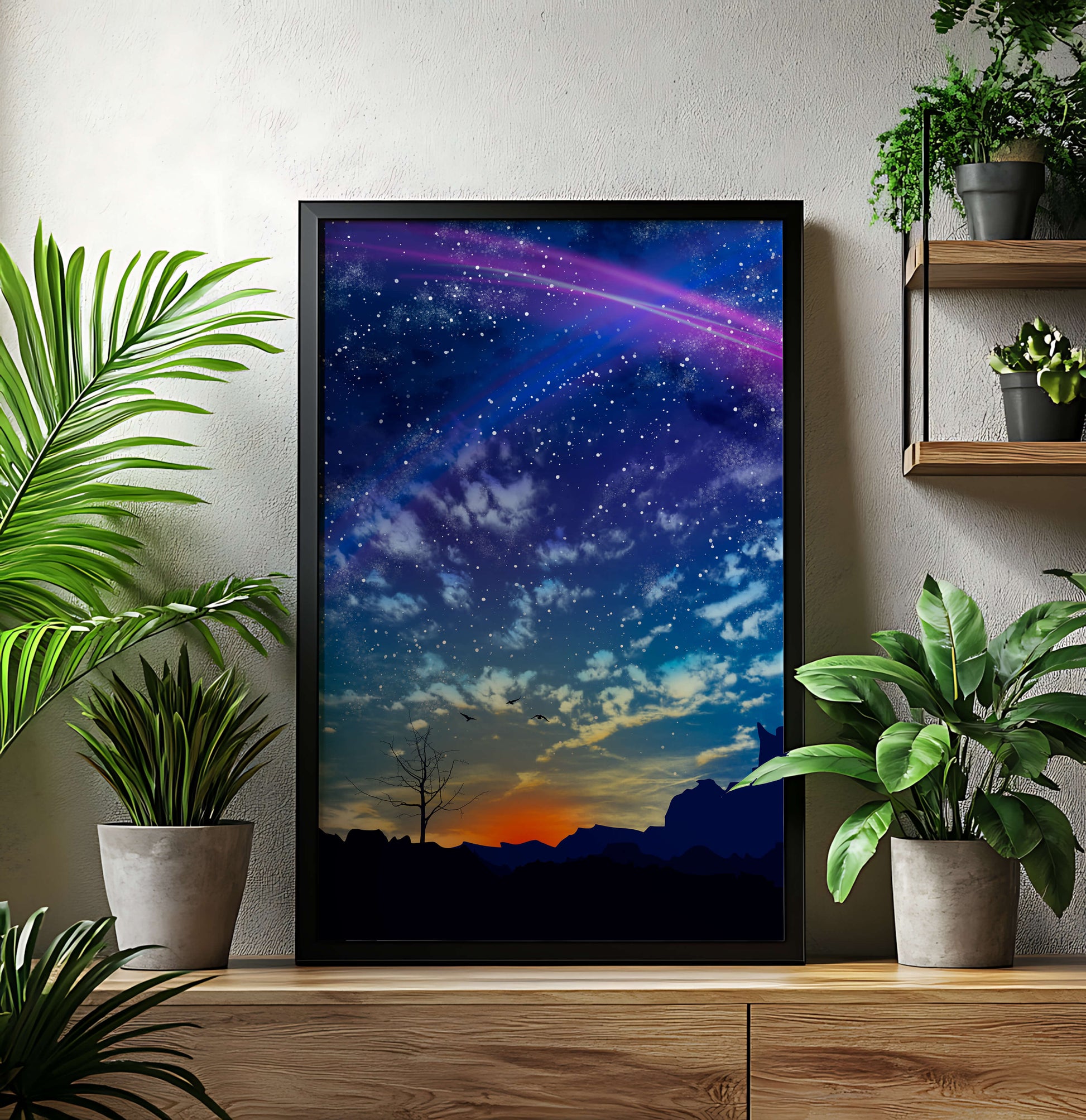 Starlit night sky with colorful sunset and silhouetted landscape