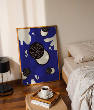 Graphic design featuring cookies and milk splashes on blue background