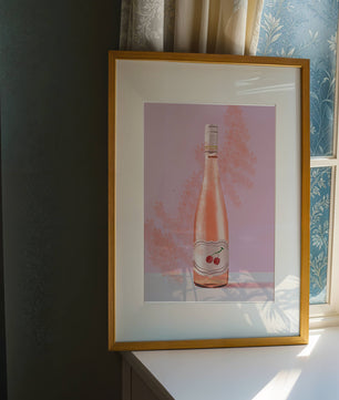 Illustrated wine bottle with a cherry label on pink background