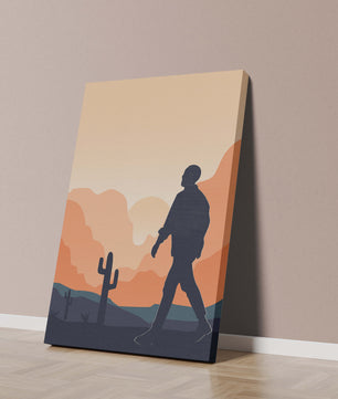 Silhouetted figure walking in desert landscape at sunset