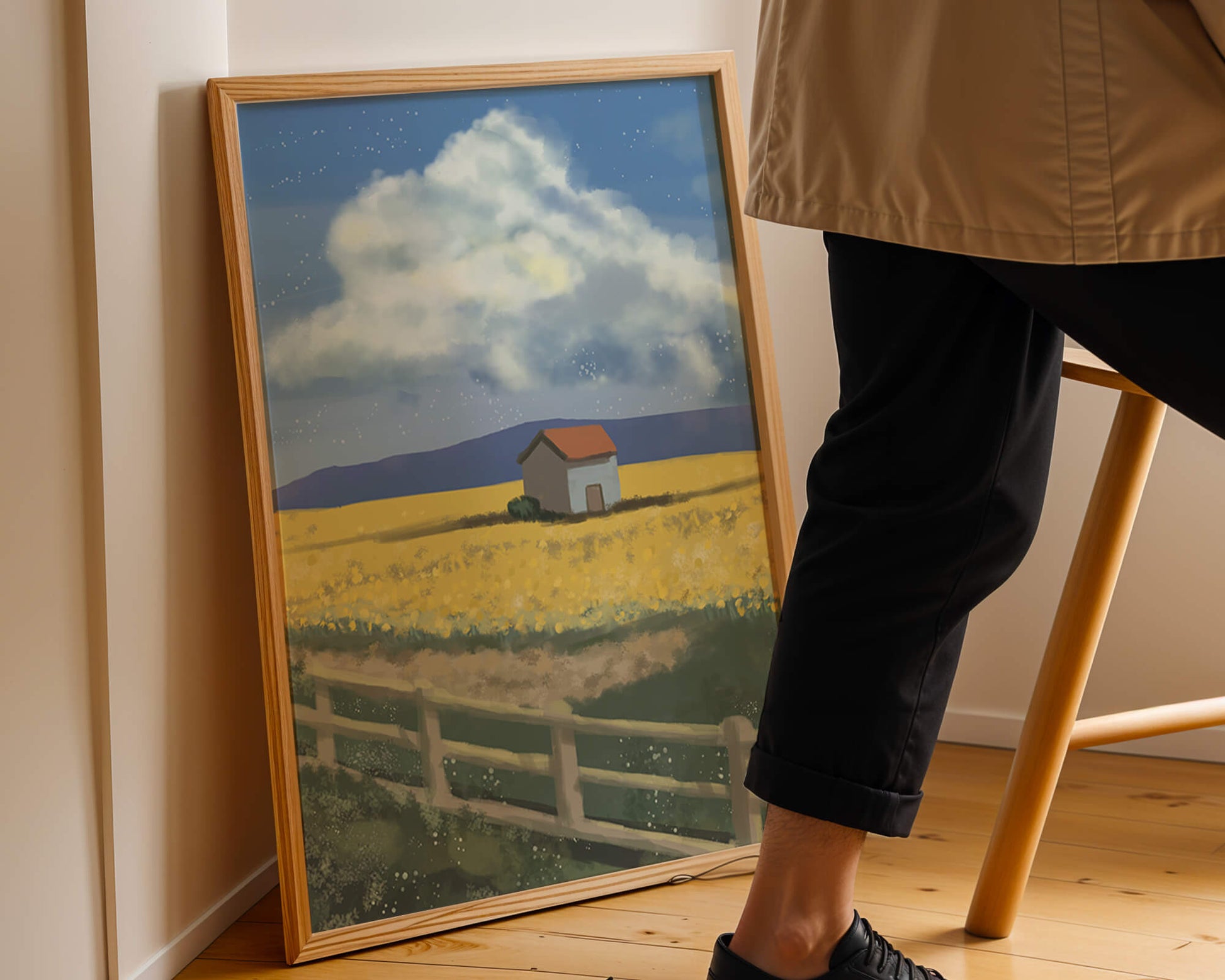 Idyllic rural scene with house and yellow field under blue sky