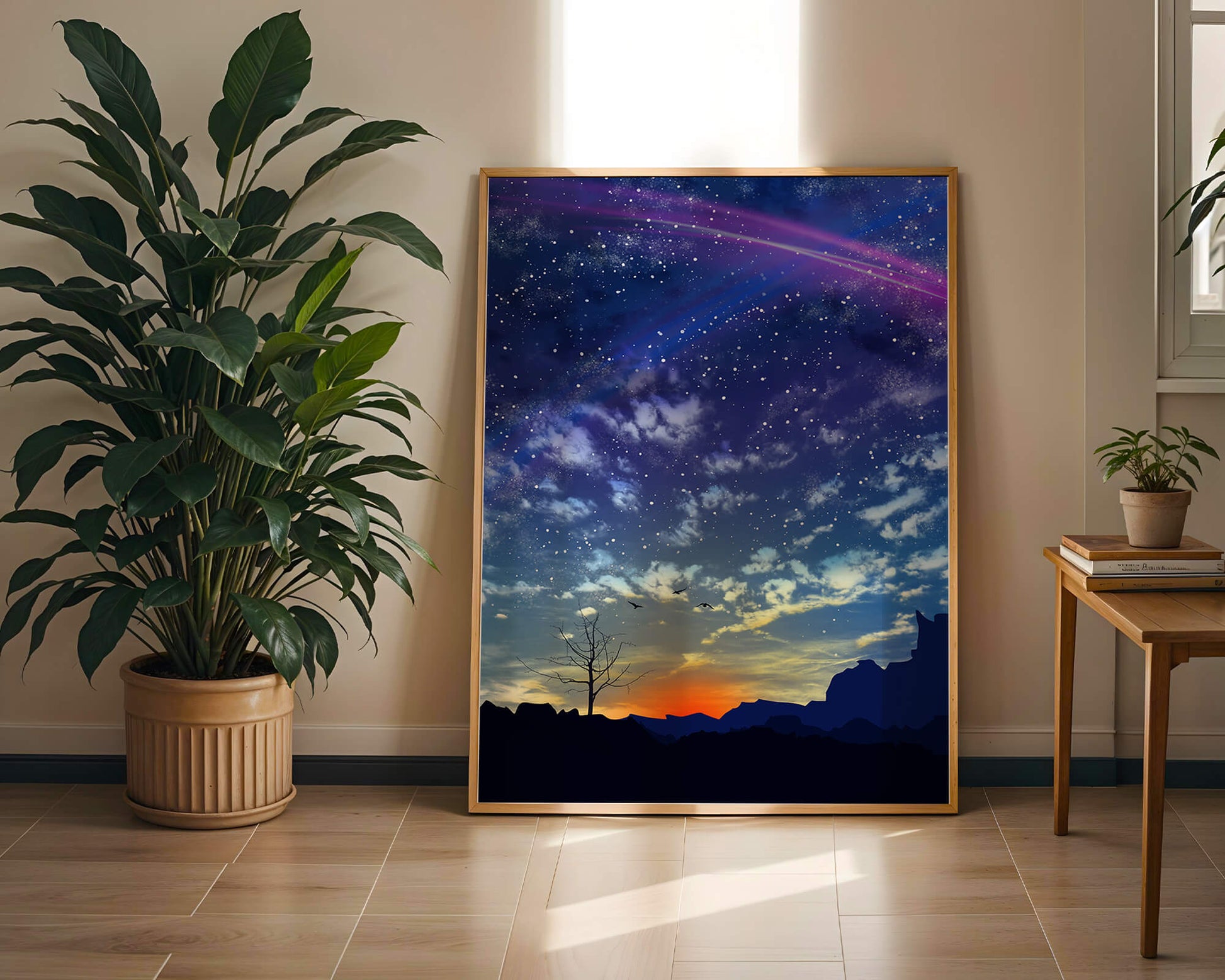 Starlit night sky with colorful sunset and silhouetted landscape