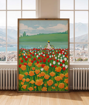 Woman with bicycle in vibrant tulip field by a lake