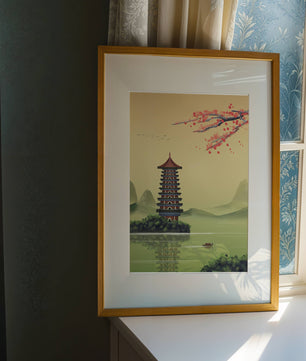 Serene landscape with traditional pagoda and blooming cherry blossoms