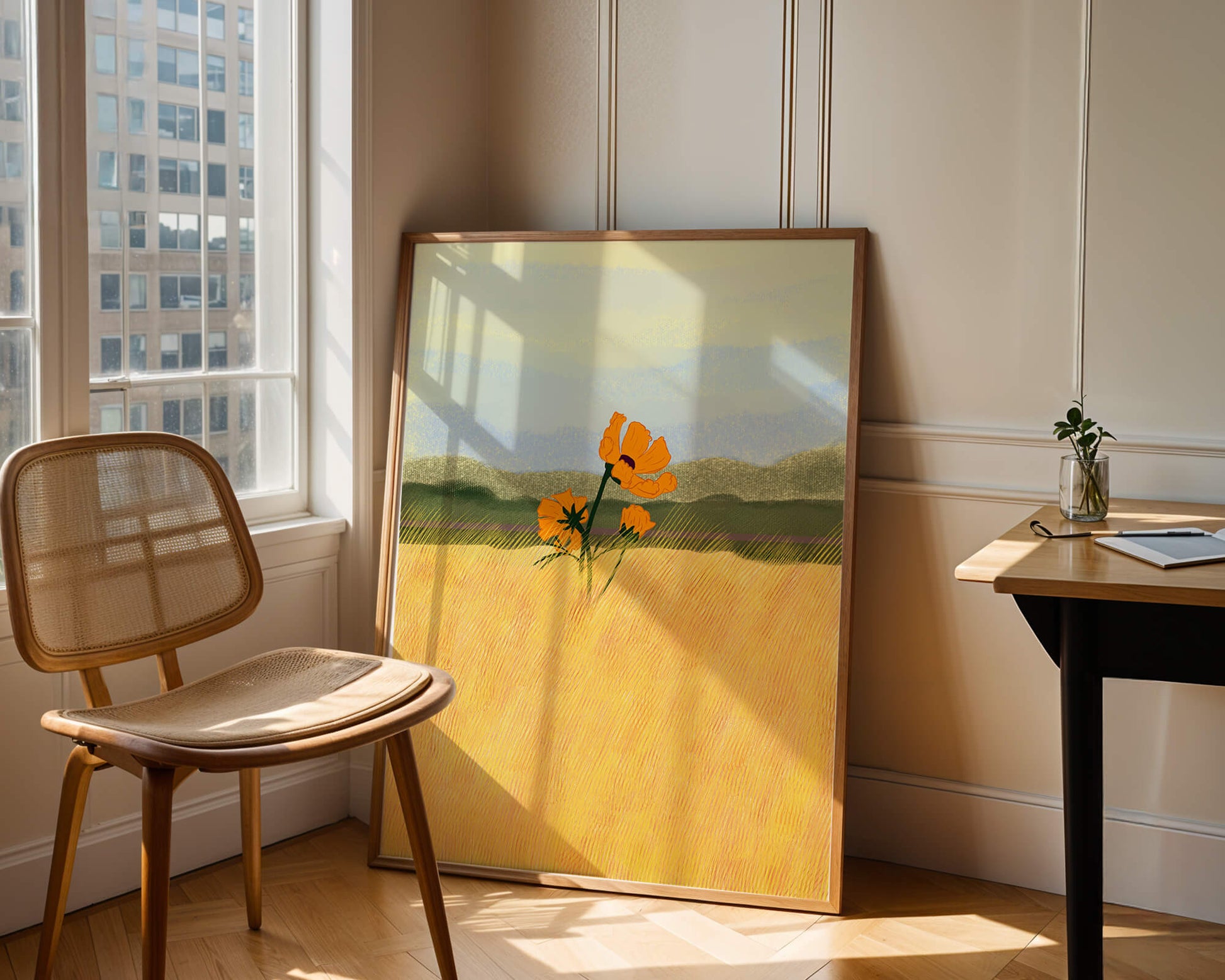 Orange Flowers in a Golden Field with Mountains and Blue Sky
