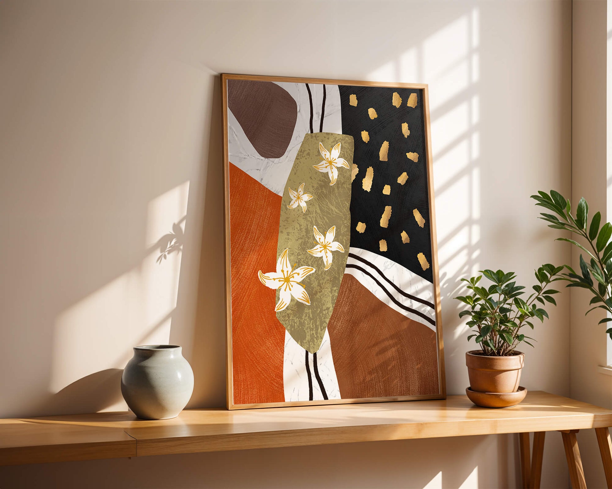 Abstract floral artwork with gold accents and earthy tones
