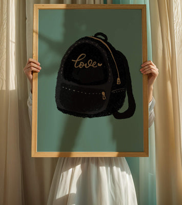 Elegant black backpack with gold accents and love inscription