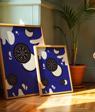 Graphic design featuring cookies and milk splashes on blue background