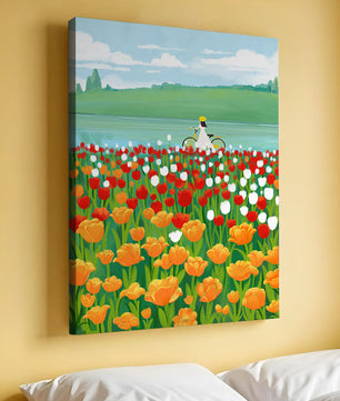 Woman with bicycle in vibrant tulip field by a lake