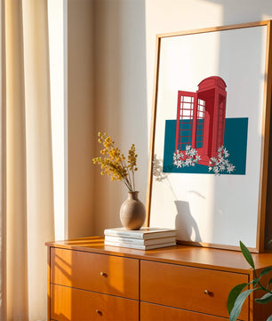 A Pink Phone Booth Surrounded by Flowers on a Teal Background