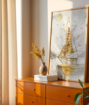 Elegant sailboat with gold elements against a textured sky