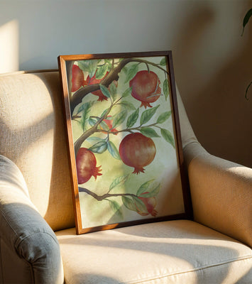 Watercolor illustration of pomegranates on a branch with leaves