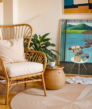 Scenic view from a room overlooking a tranquil water garden with stepping stones and mountains