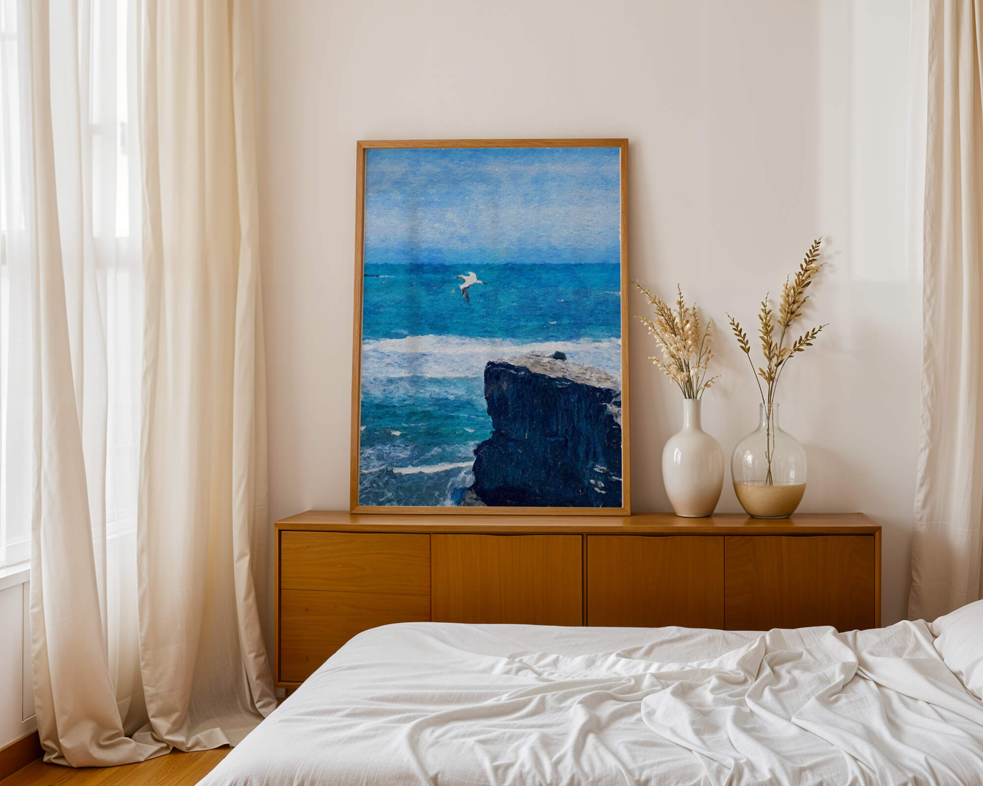 Seascape with soaring seagull over rocky cliff and ocean waves