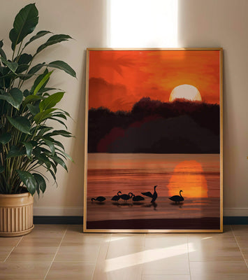Serene sunset over a lake with silhouetted swans