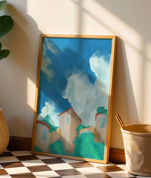 Serene landscape with houses and fluffy clouds against a blue sky