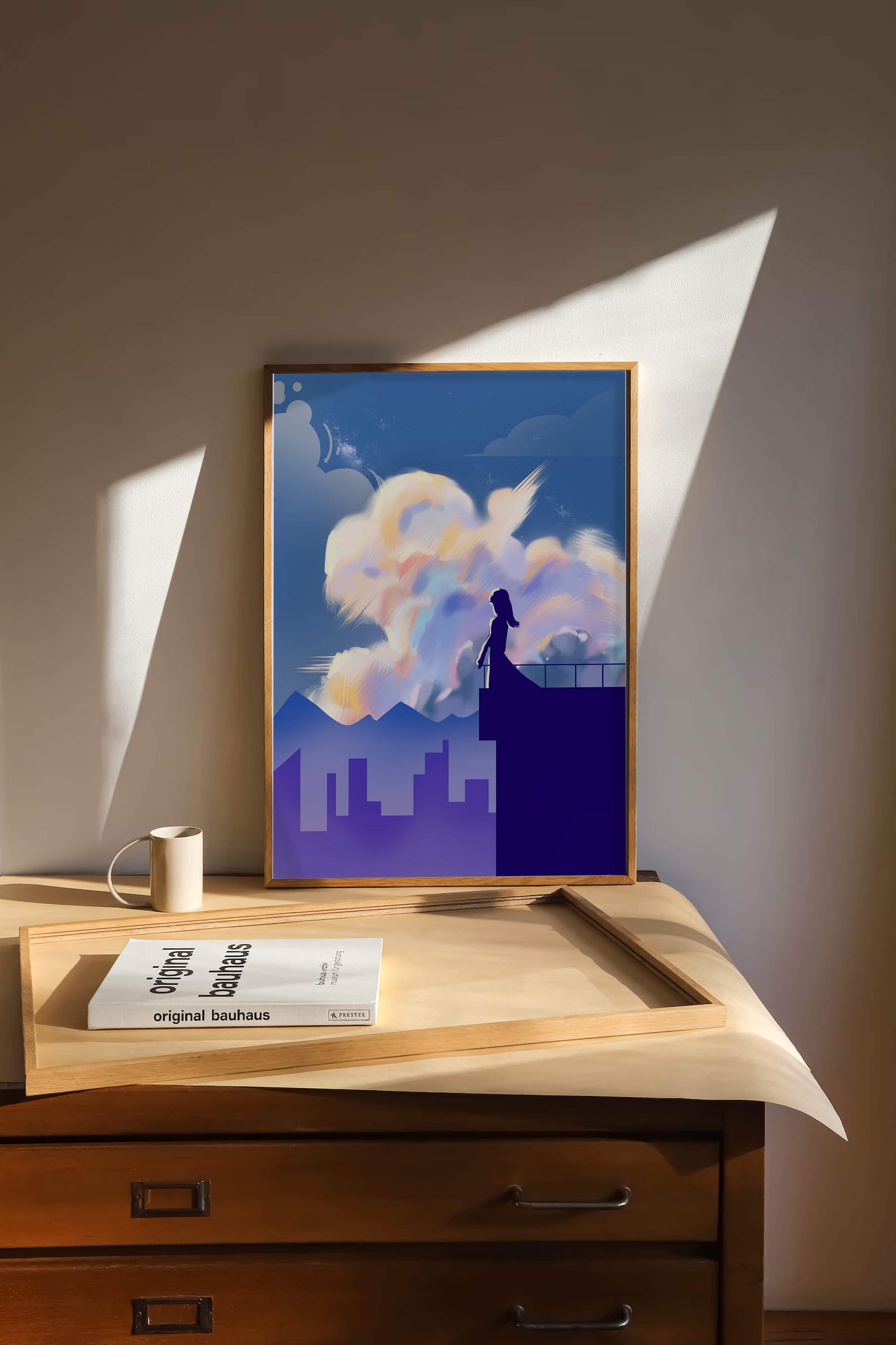 Silhouette of a woman on rooftop against a dreamy sky with colorful clouds