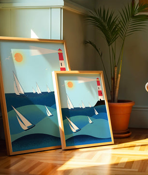 Coastal scene with sailboats and lighthouse on a bright sunny day