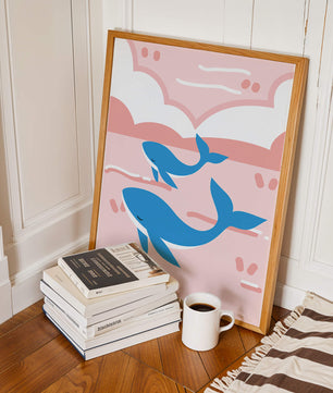 Playful whales illustration in pastel pink and blue