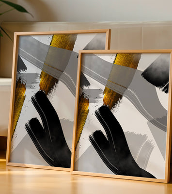 Abstract art piece with gold and black brushstrokes on a gray background