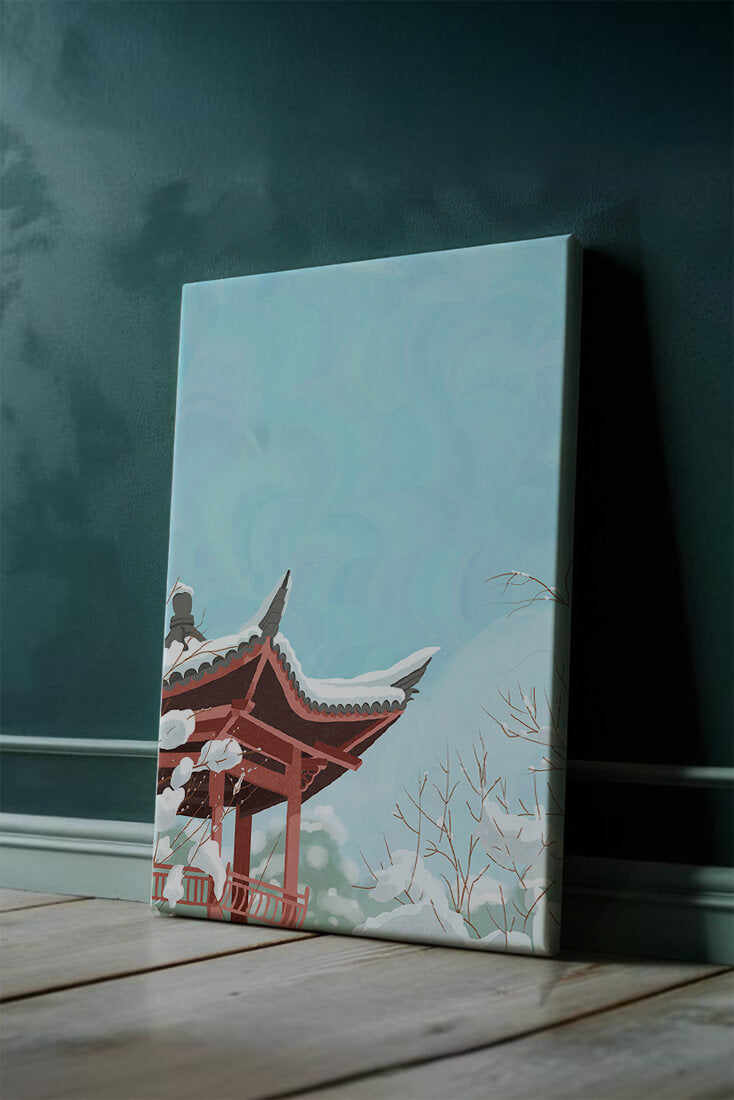 Snow-covered traditional pagoda under a clear blue sky