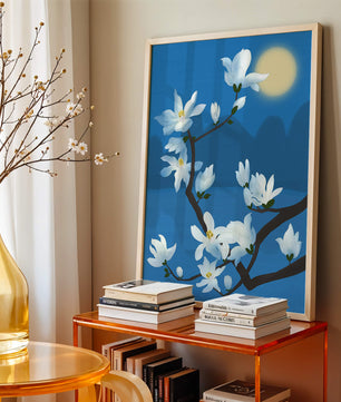 White magnolia branch under moonlight with blue background