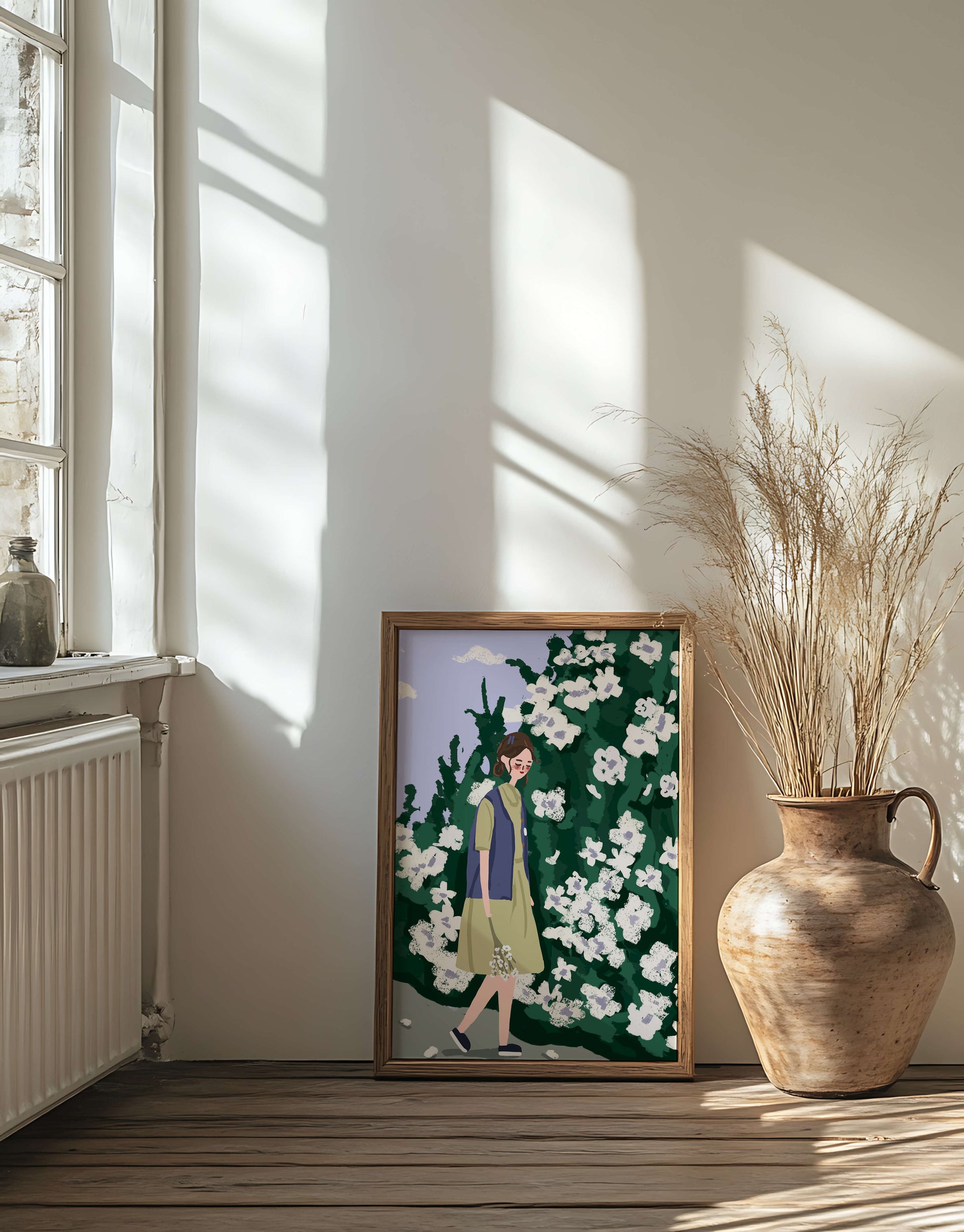 Woman walking by a lush white flower bush on a sunny day
