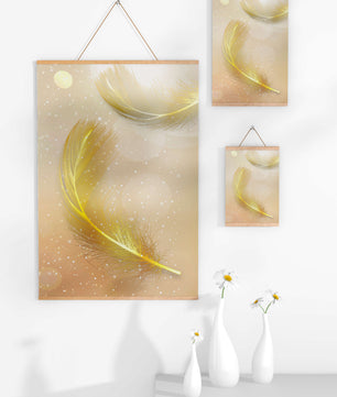 Elegant golden feathers with sparkling particles on soft background