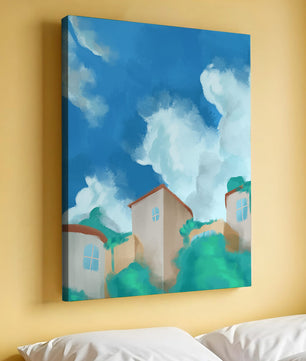 Serene landscape with houses and fluffy clouds against a blue sky