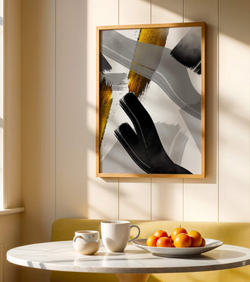 Abstract art piece with gold and black brushstrokes on a gray background