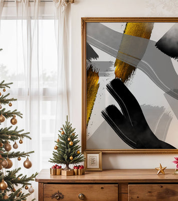 Abstract art piece with gold and black brushstrokes on a gray background