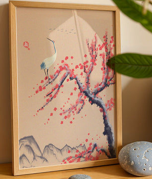 Elegant crane on cherry blossom tree with mountainous background