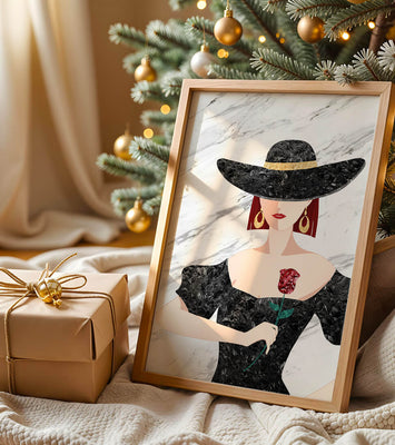 Elegant woman in wide-brimmed hat holding a rose on marble background