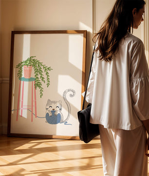 Cat Playing with Yarn Beside a Potted Plant on Pink Stool - Mi tienda