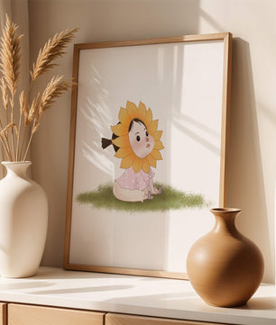 Adorable child with sunflower costume sitting on a grassy patch