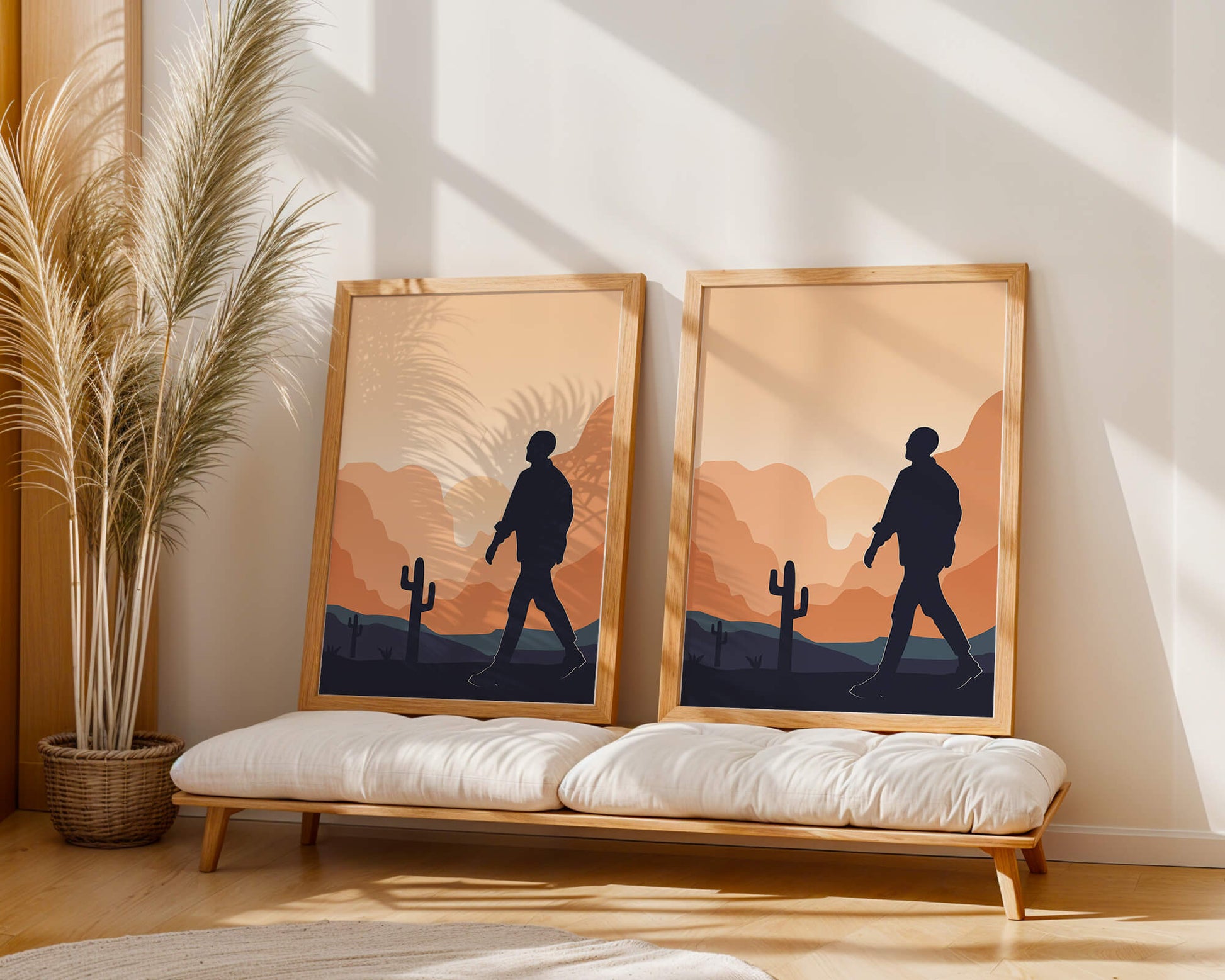 Silhouetted figure walking in desert landscape at sunset